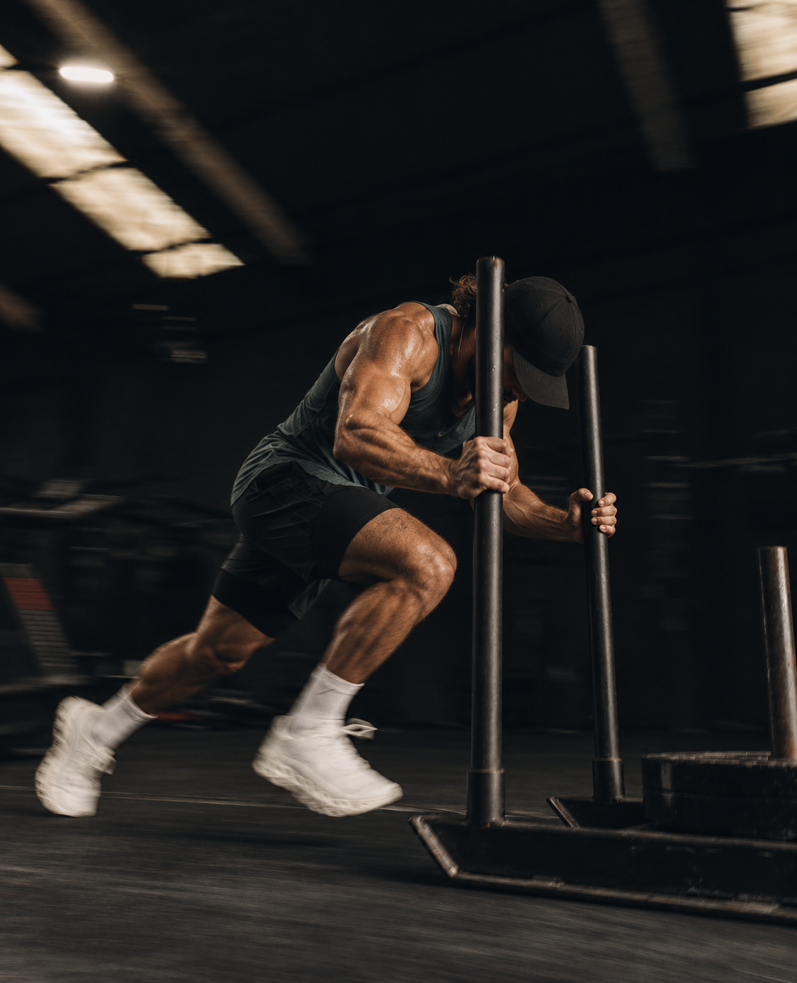 Athlete pushing a weighted sled